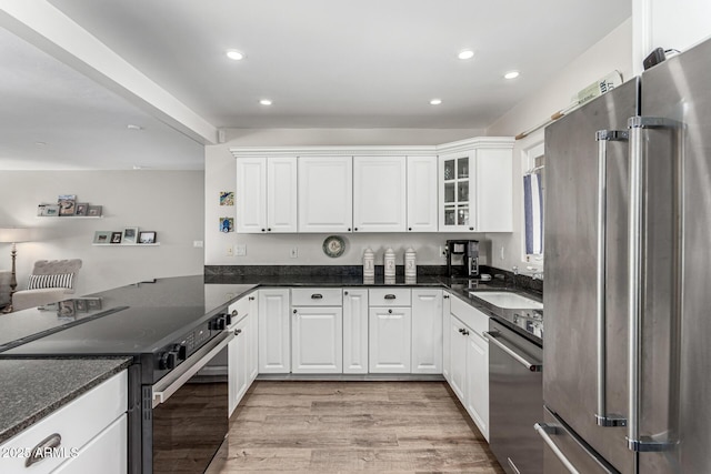 3420 N Kachina Ln, Scottsdale, AZ 85251 - kitchen with stainless steel appliances, a sink, white cabinetry, light wood-style flooring, and recessed lighting