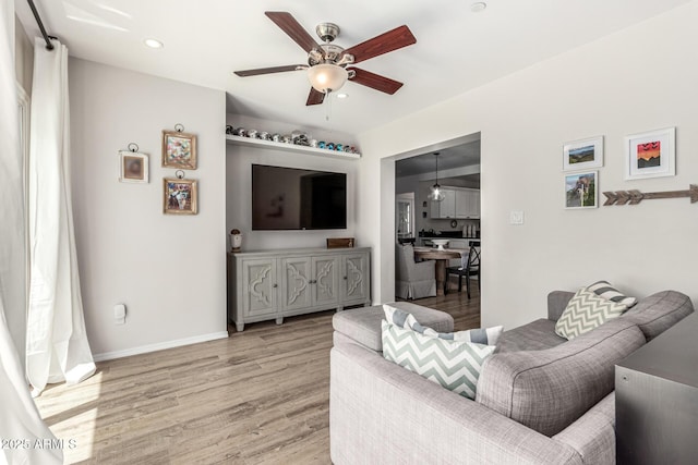 3420 N Kachina Ln, Scottsdale, AZ 85251 - living room with a ceiling fan, light wood-style floors, recessed lighting, and baseboards