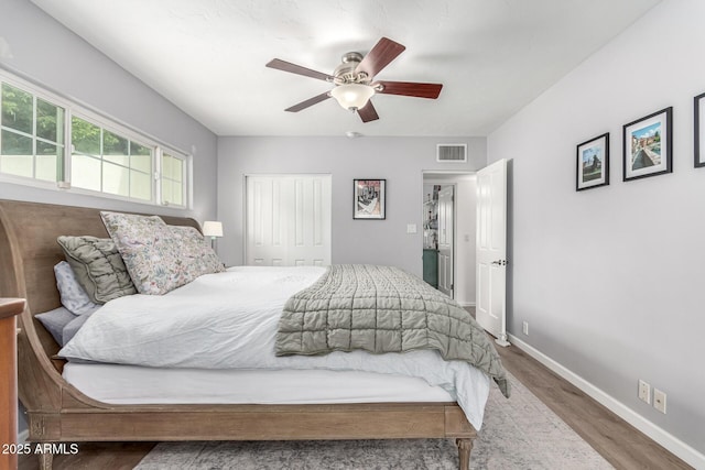 3420 N Kachina Ln, Scottsdale, AZ 85251 - bedroom with wood finished floors, a closet, baseboards, and a ceiling fan