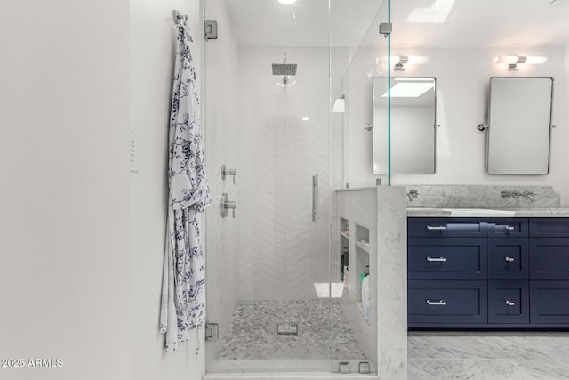 3420 N Kachina Ln, Scottsdale, AZ 85251 - bathroom featuring a stall shower, double vanity, and marble look tiles