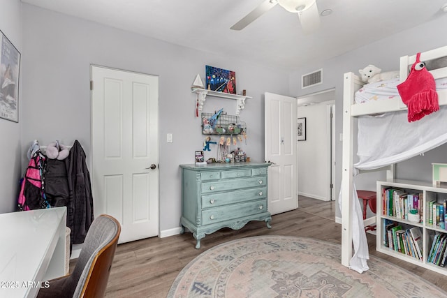 3420 N Kachina Ln, Scottsdale, AZ 85251 - bedroom with wood finished floors, a ceiling fan, and baseboards