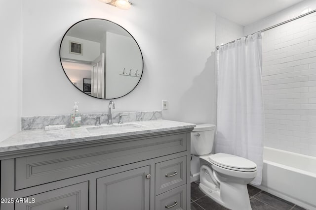 3420 N Kachina Ln, Scottsdale, AZ 85251 - full bathroom with toilet, vanity, tile patterned floors, and shower / tub combo
