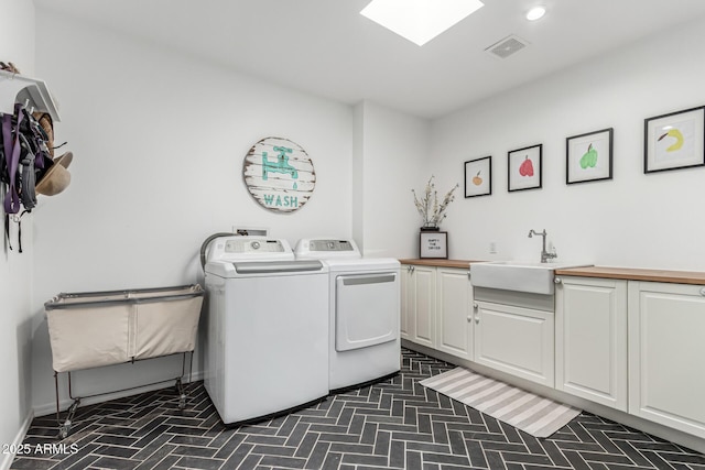 3420 N Kachina Ln, Scottsdale, AZ 85251 - washroom with washer and dryer, cabinet space, recessed lighting, and brick patterned flooring