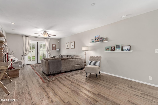 3420 N Kachina Ln, Scottsdale, AZ 85251 - living area with wood finished floors, a ceiling fan, and baseboards
