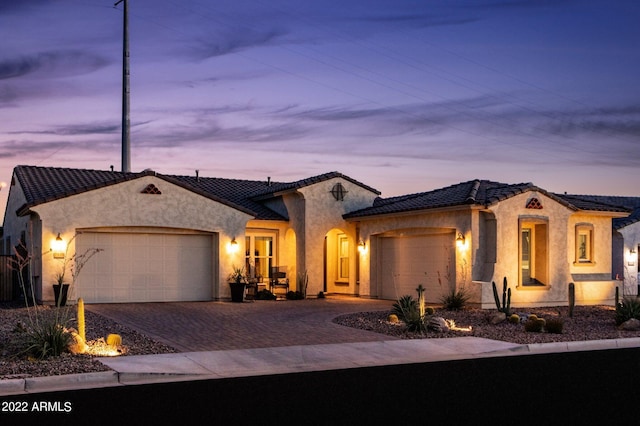 mediterranean / spanish-style house featuring a garage