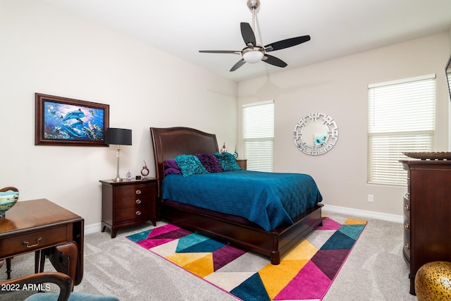 carpeted bedroom featuring ceiling fan