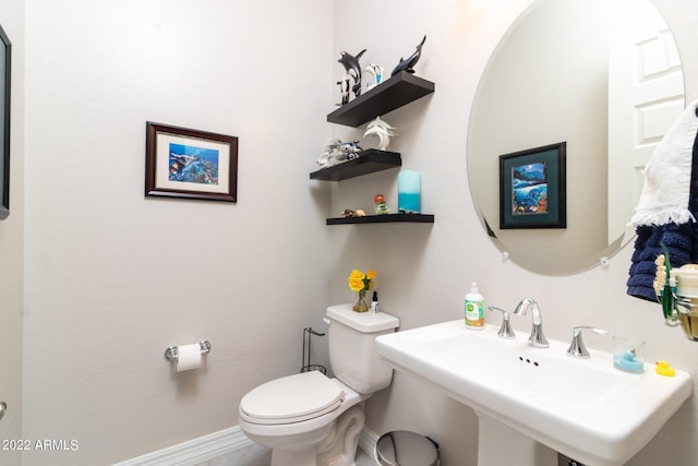 bathroom featuring sink and toilet