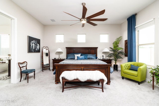 bedroom featuring light carpet and ceiling fan