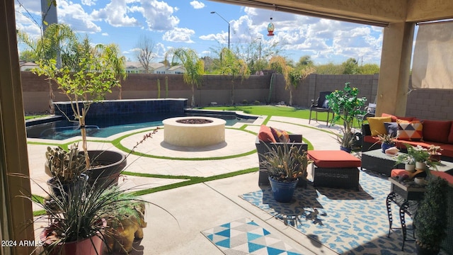 view of patio / terrace featuring an outdoor living space with a fire pit