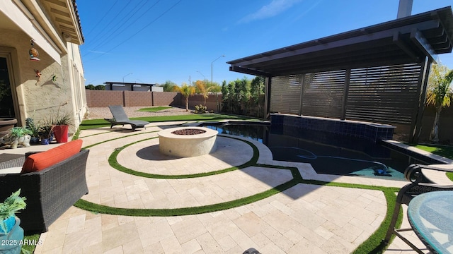 view of patio featuring an outdoor fire pit