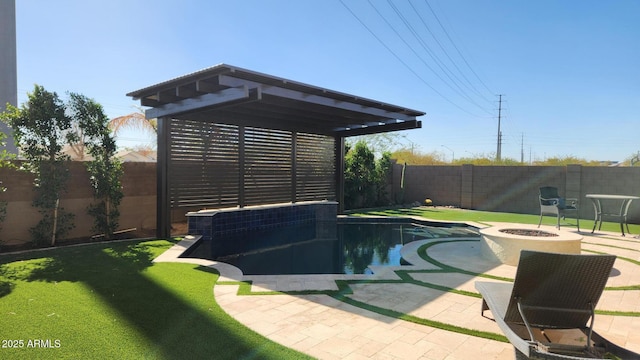 view of pool featuring a patio, a yard, and a fire pit