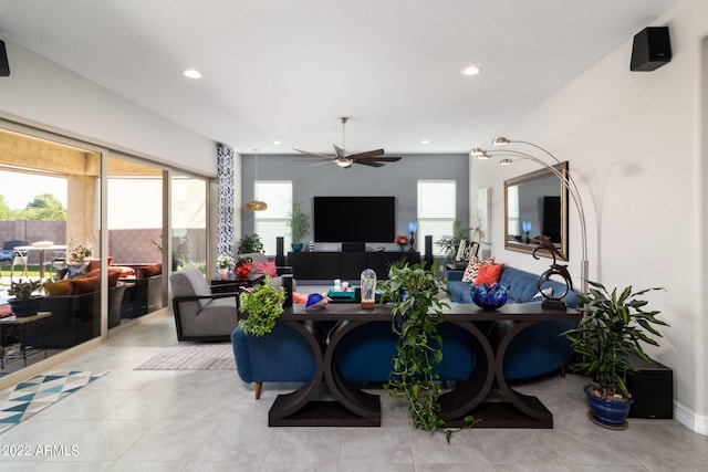 tiled living room featuring ceiling fan