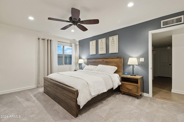 carpeted bedroom with ceiling fan