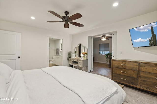 bedroom featuring ceiling fan and ensuite bath