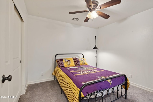 bedroom with ceiling fan, a closet, and carpet flooring