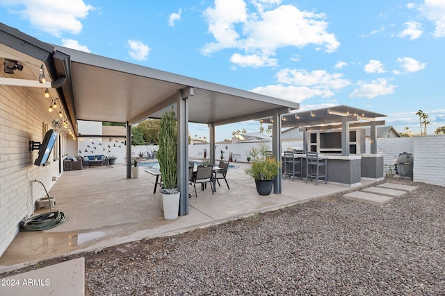 view of patio with exterior bar