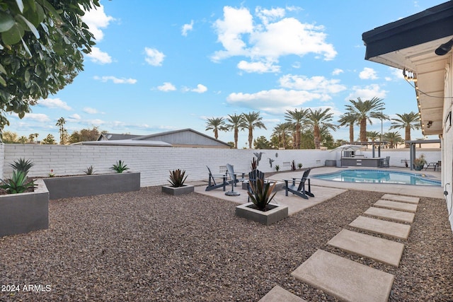 exterior space featuring a patio area and a fenced in pool