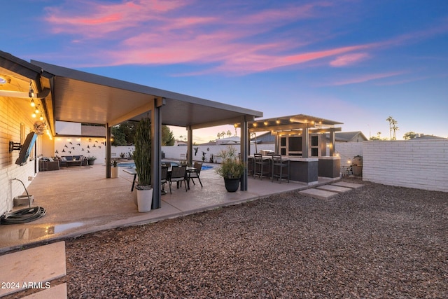 exterior space featuring a patio area and exterior bar