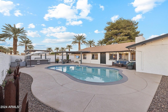 view of swimming pool with a patio area and outdoor lounge area