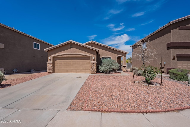 14244 N 132nd Ln, Surprise, AZ 85379 - mediterranean / spanish-style house with driveway, stucco siding, an attached garage, and stone siding