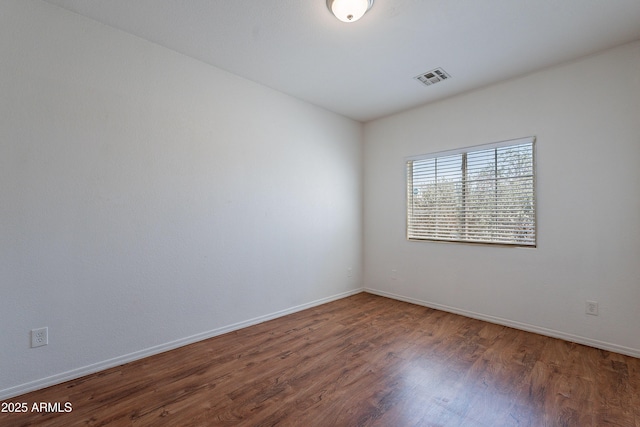 14244 N 132nd Ln, Surprise, AZ 85379 - unfurnished room with visible vents, wood finished floors, and baseboards