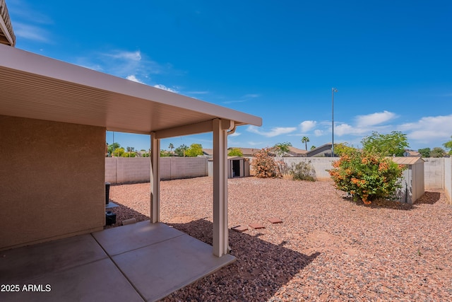 14244 N 132nd Ln, Surprise, AZ 85379 - view of yard featuring a storage shed, an outbuilding, a patio area, and a fenced backyard