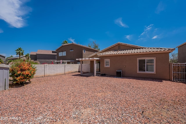 14244 N 132nd Ln, Surprise, AZ 85379 - back of house featuring central air condition unit, stucco siding, a tile roof, and a fenced backyard