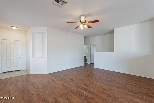 14244 N 132nd Ln, Surprise, AZ 85379 - unfurnished room with ceiling fan, baseboards, visible vents, and wood finished floors