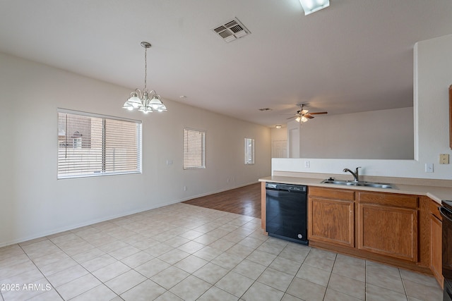 14244 N 132nd Ln, Surprise, AZ 85379 - kitchen with a sink, brown cabinetry, visible vents, black appliances, and light tile patterned flooring