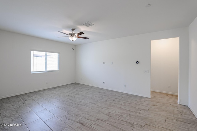 spare room with ceiling fan