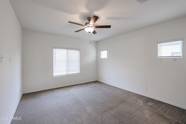 carpeted empty room featuring ceiling fan