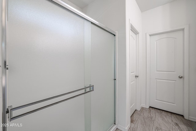 bathroom featuring an enclosed shower