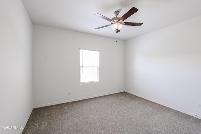 empty room with carpet flooring and ceiling fan