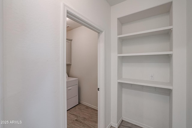 laundry room featuring cabinets and washer / clothes dryer