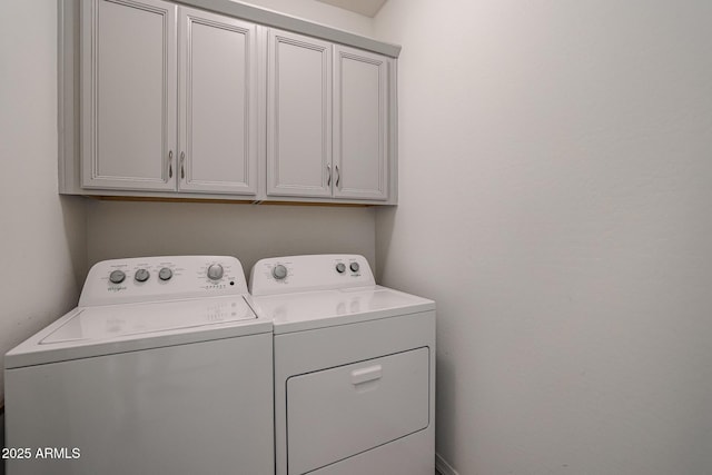 laundry room featuring cabinets and independent washer and dryer