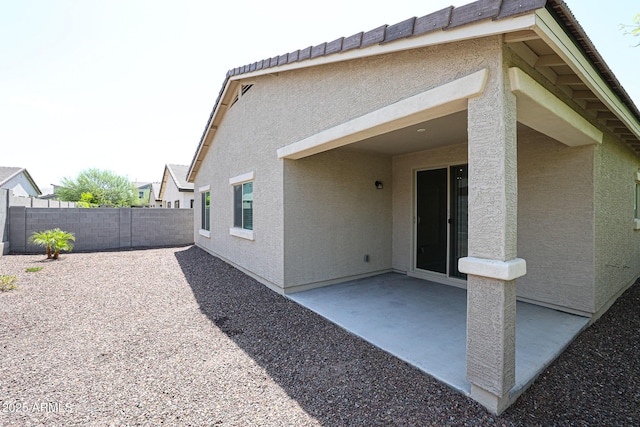 back of property with a patio area