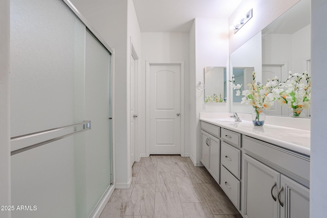 bathroom with vanity and walk in shower