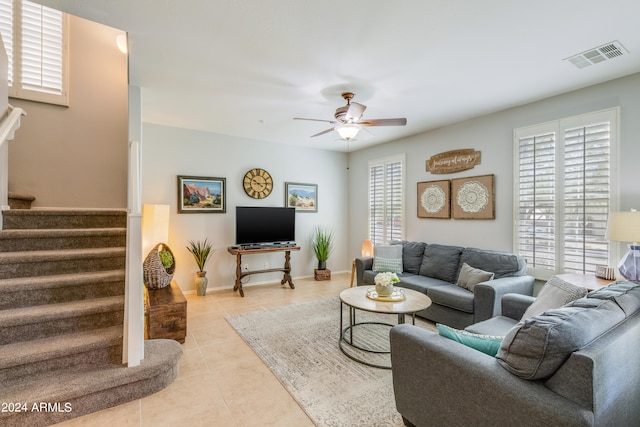 tiled living room featuring ceiling fan