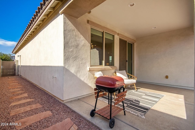 view of patio / terrace with grilling area and fence