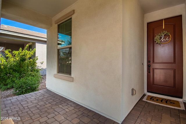 doorway to property with stucco siding