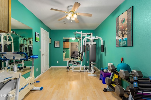 11540 S Morningside Dr, Goodyear, AZ 85338 - workout room with wood finished floors, ceiling fan, and baseboards