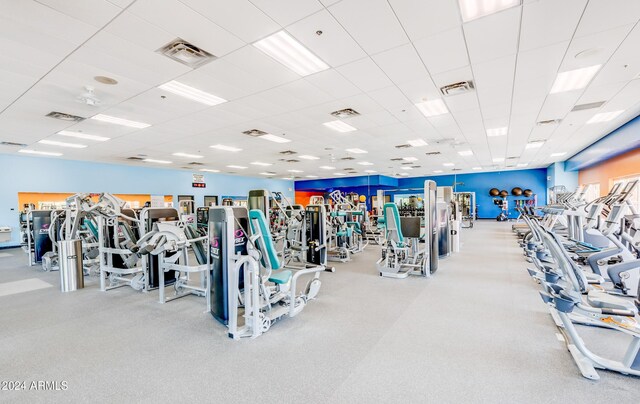 exercise room with a drop ceiling