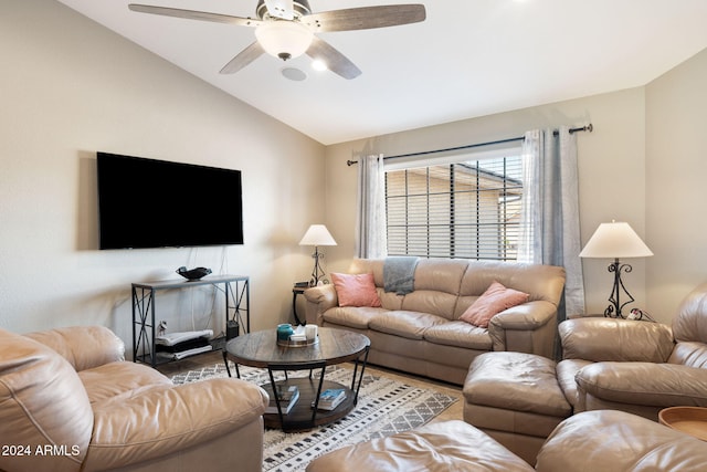 living room with hardwood / wood-style flooring, ceiling fan, and lofted ceiling