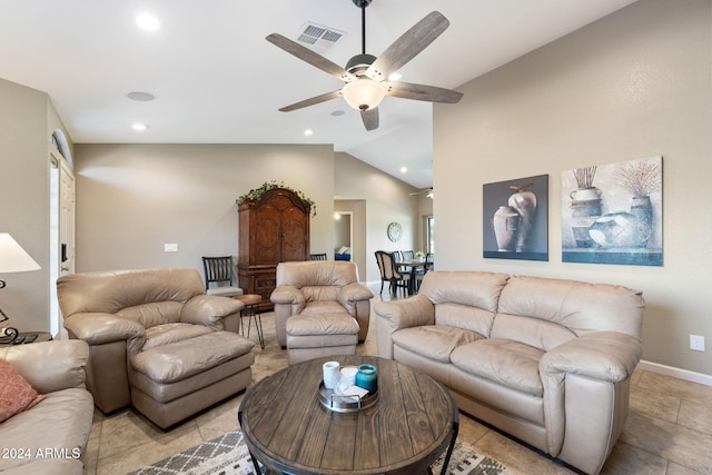 living room with ceiling fan, light tile patterned floors, and vaulted ceiling