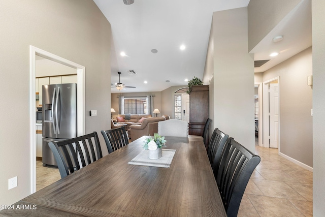 tiled dining space with ceiling fan