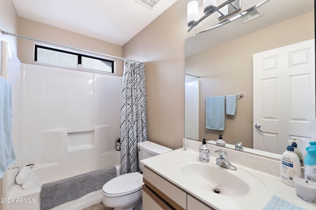 full bathroom with vanity, shower / bath combination with curtain, and toilet