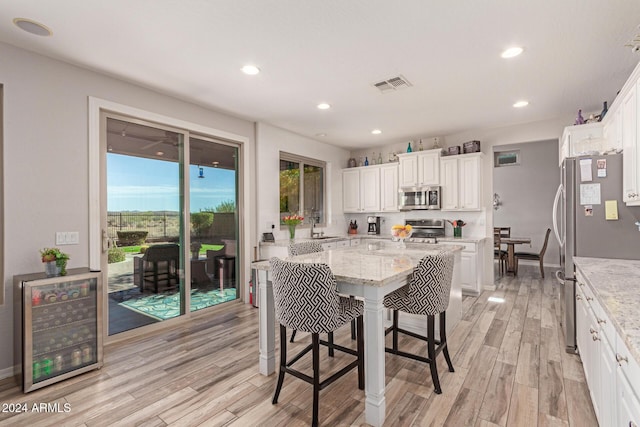 dining area with light hardwood / wood-style floors and sink