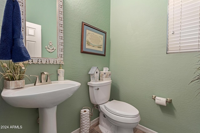 bathroom featuring toilet