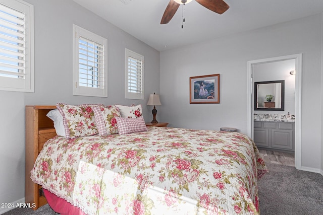 bedroom with carpet flooring, ensuite bathroom, and ceiling fan