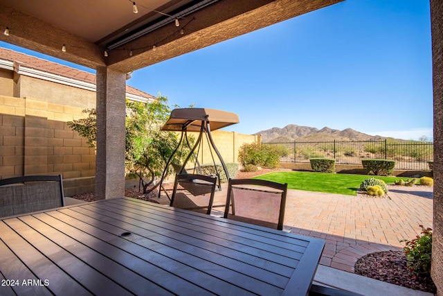 view of patio / terrace featuring a mountain view